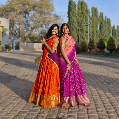 Dazzling Bright Orange & Royal Purple Half Saree with Shimmering Golden Accents, Perfect for a Mesmerizing Festive Glow! paired with a matching running blouse (unstitched for a perfect custom fit).✨💃🌅"